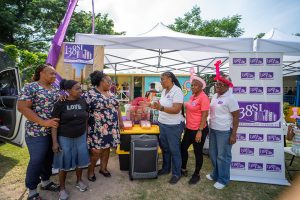 Manager of the City of Refuge Children’s Home, Sherine Blake-Louther, (3rd left) is engaged in conversations with 138 Student Living’s Public Relations & Marketing Manager, Karelle McCormack, during the handing over of gift items during the recently held Christmas Treat at the Jamaica National Children’s Home in Papine. Sharing in the moment from left are: Caregivers Keisha Myres-Richards and Pamella Brown, Carlene Champagnie-Douglas, Senior Customer Experience Representative and Marva Thompson, Resident Relations Chief from 138 Student Living.